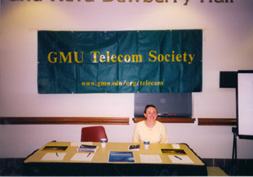 Sheri Keyser welcomes attendees at the registration table